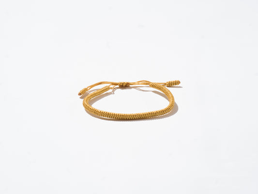 Saffron Woven String Bracelet - Handmade at Sangha House