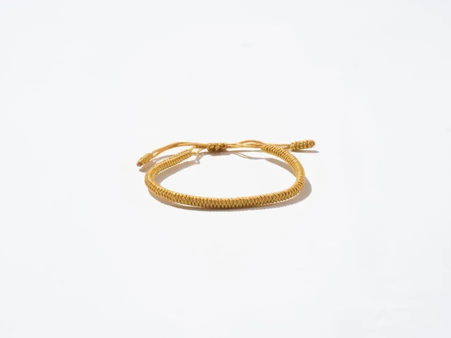 Saffron Woven String Bracelet - Handmade at Sangha House